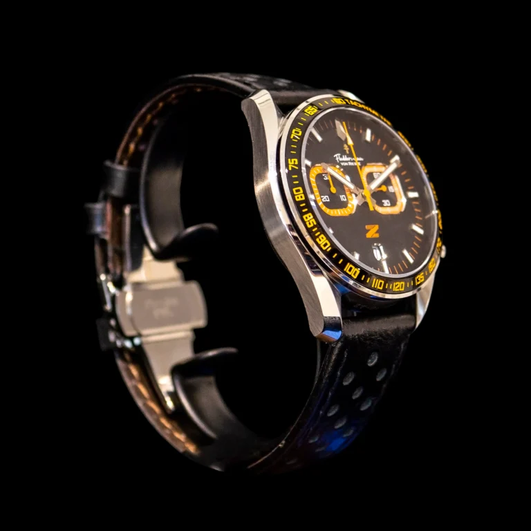 Left-side profile of the Zeitfahrene in Night Fall Black with orange dial accents visible